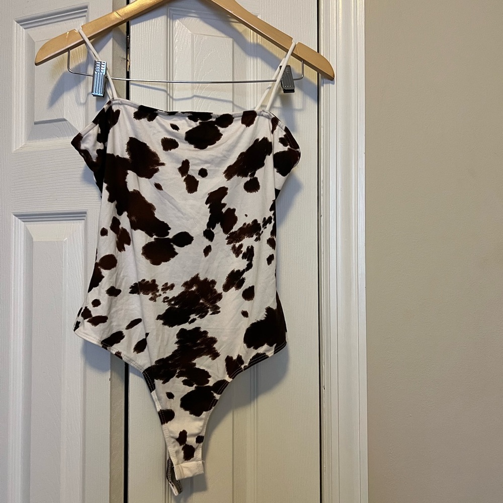 NWT. cow print bodysuit